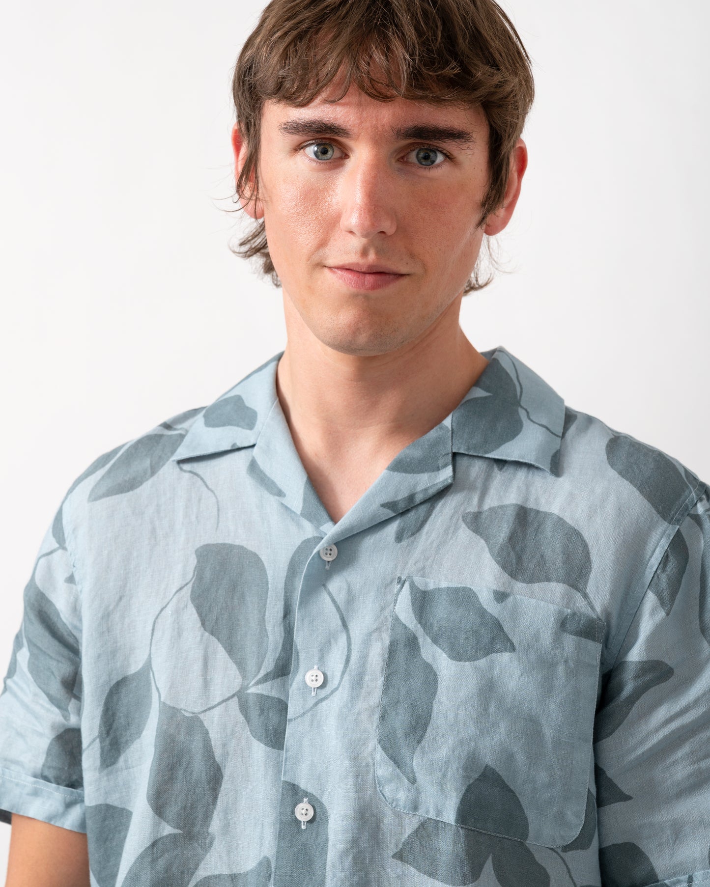 close up of model wearing a Oliver Sweeney Marvao Mens Linen Shirt in Blue