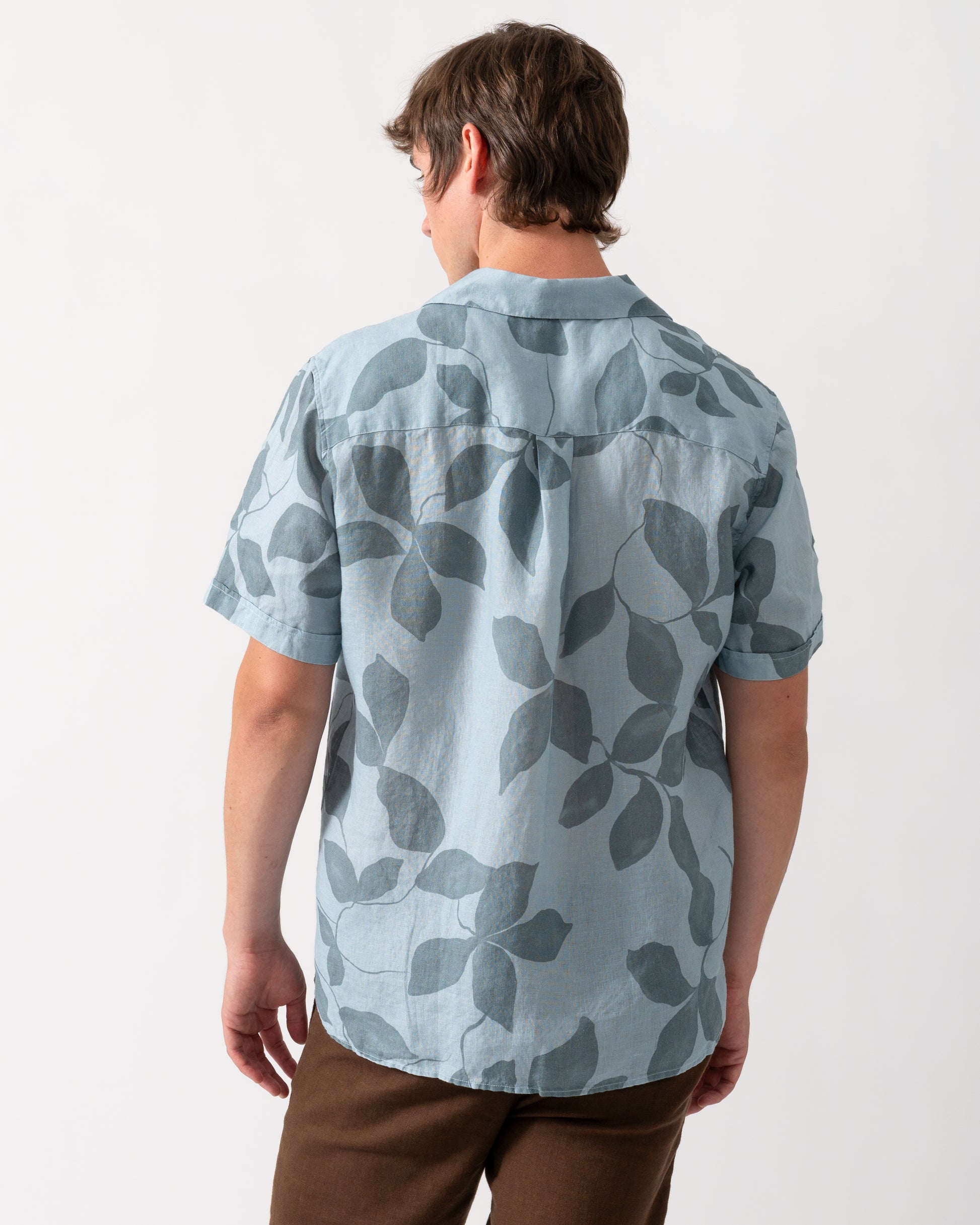 back of model wearing a Oliver Sweeney Marvao Mens Linen Shirt in Blue