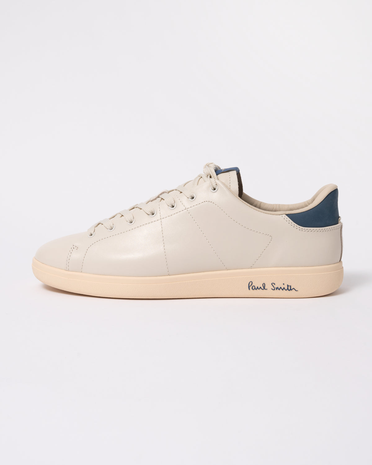 Studio photograph showing side of PS Paul Smith Chip Leather Mens Trainers in 01 White