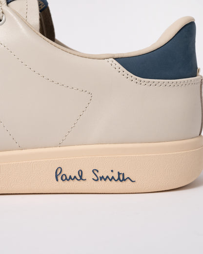 Studio photograph showing heel detail of PS Paul Smith Chip Leather Mens Trainers in 01 White