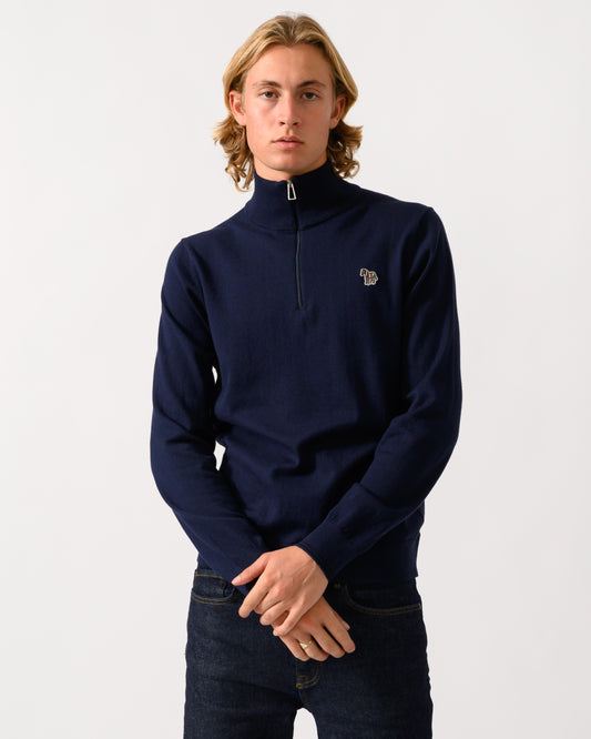 studio photograph of a model wearing a PS Paul Smith Mens 1/4 Zip Zebra Badge Sweater in 49 Very Dark Navy