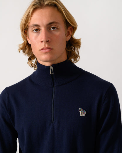 close up studio photograph of a model wearing a PS Paul Smith Mens 1/4 Zip Zebra Badge Sweater in 49 Very Dark Navy