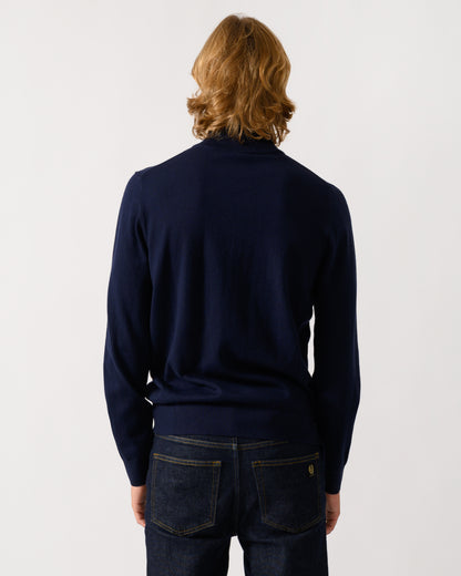 studio photograph showing back of a model wearing a PS Paul Smith Mens 1/4 Zip Zebra Badge Sweater in 49 Very Dark Navy