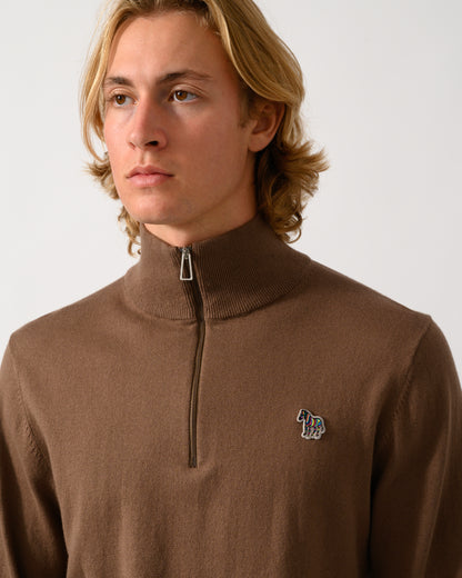 close up of model wearing a PS Paul Smith Mens 1/4 Zip Zebra Badge Sweater in 67 Mud