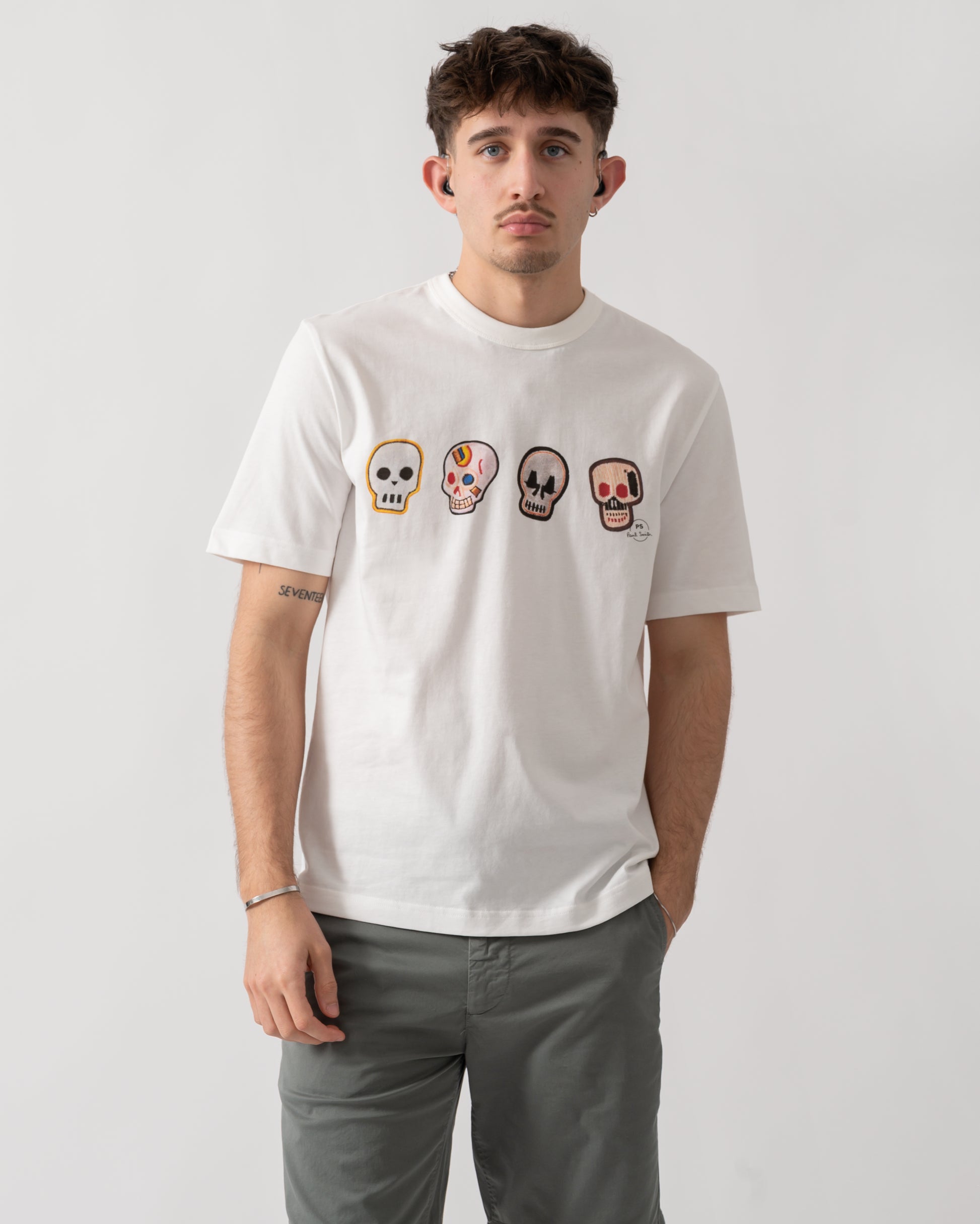 studio shot of a model wearing a PS Paul Smith Mens Casual Fit Skulls T-Shirt in 02 White