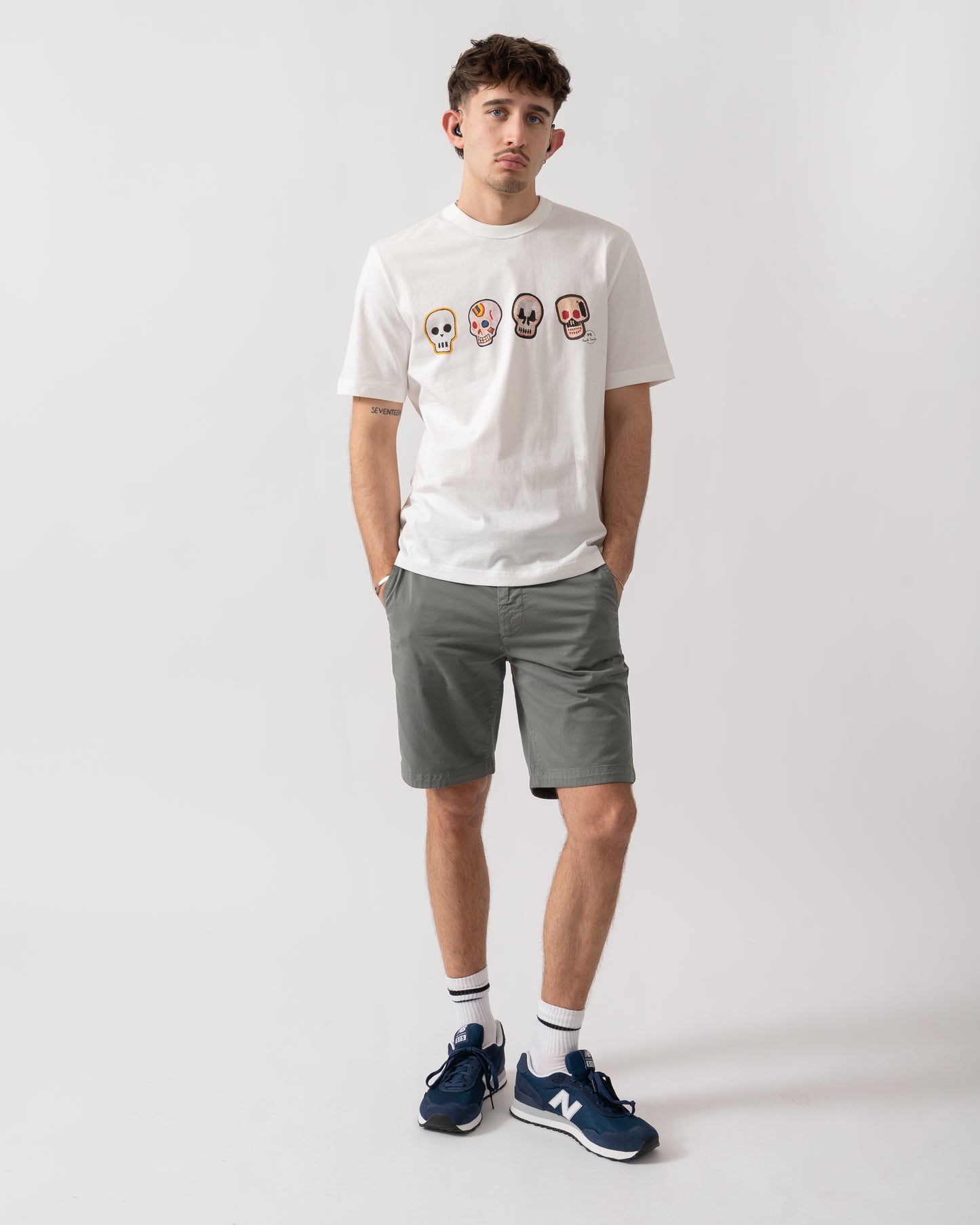 full length shot of a model wearing a PS Paul Smith Mens Casual Fit Skulls T-Shirt in 02 White
