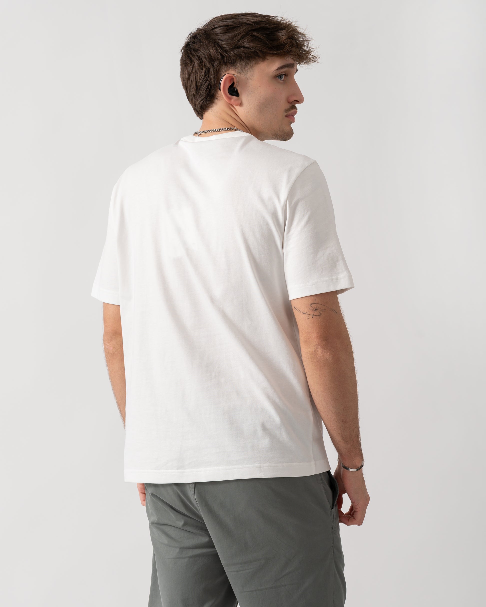 back shot of a model wearing a PS Paul Smith Mens Casual Fit Skulls T-Shirt in 02 White