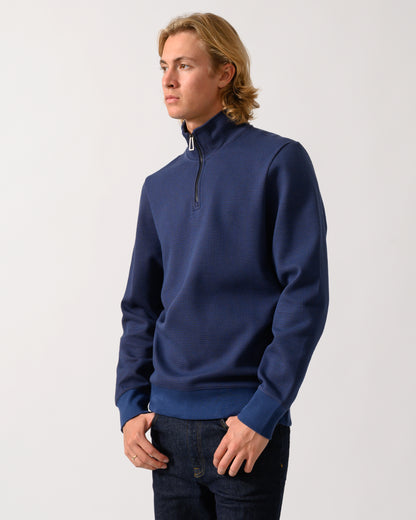 studio portrait of a model wearing a PS Paul Smith Mens Classic Half Zip Top in 46 Indigo