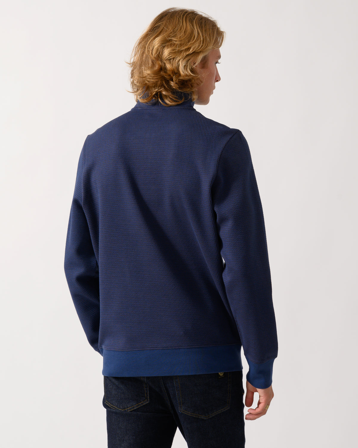 studio portrait of back of a model wearing a PS Paul Smith Mens Classic Half Zip Top in 46 Indigo