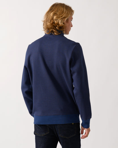 studio portrait of back of a model wearing a PS Paul Smith Mens Classic Half Zip Top in 46 Indigo