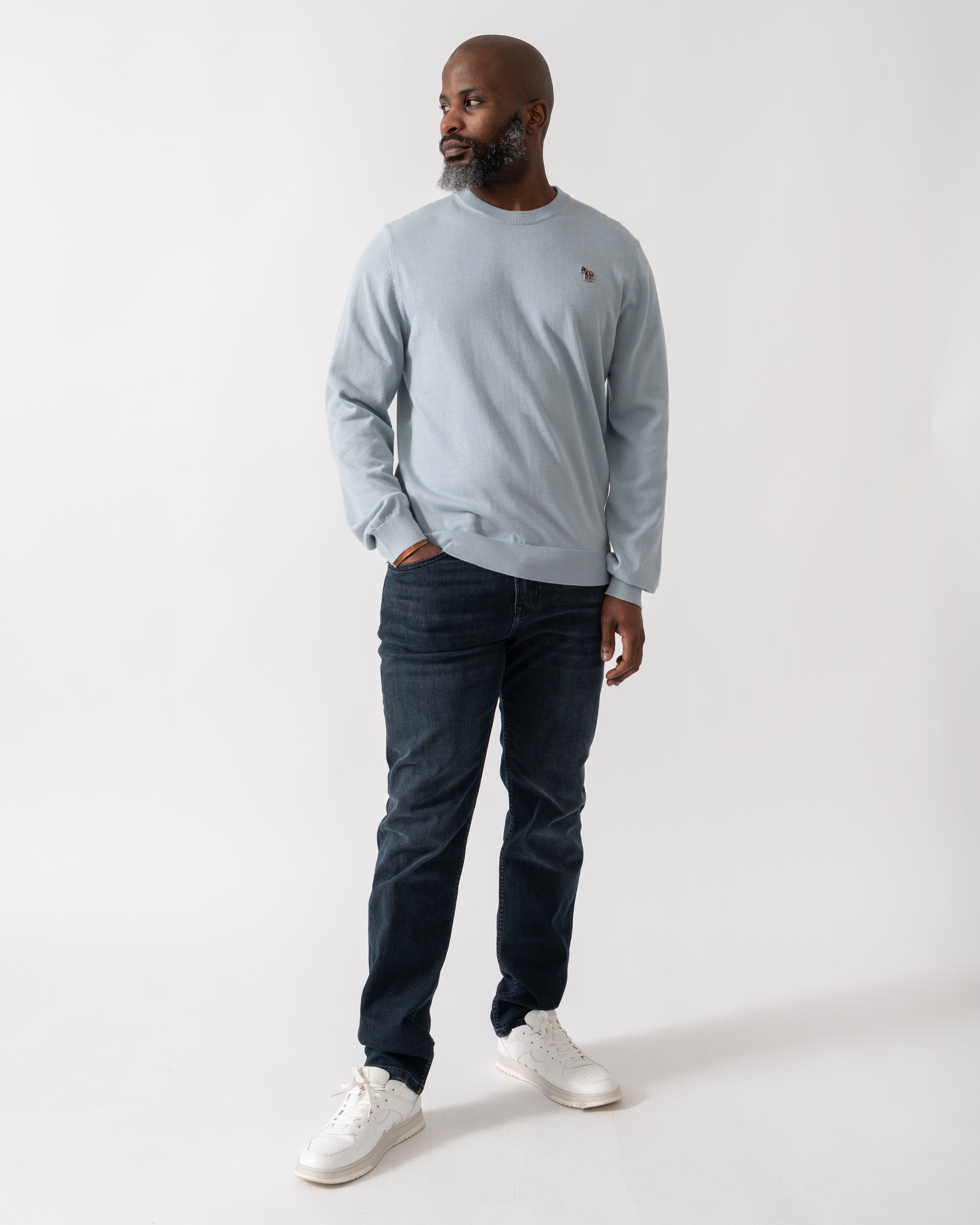 Full length shot of a Model wearing a PS Paul Smith Mens Crew Neck Zebra Badge Jumper in Blue