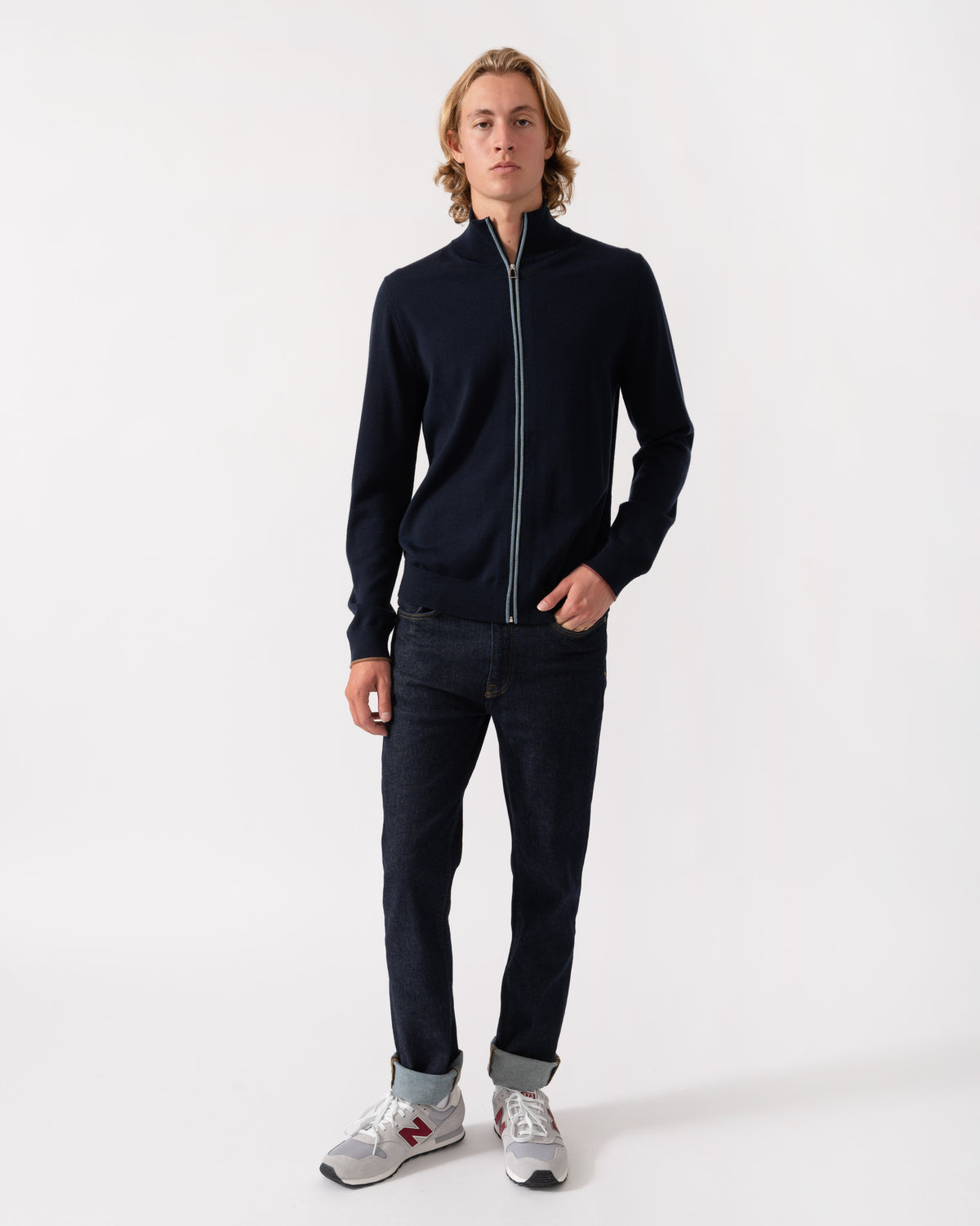 Model wearing the Paul Smith's Mens Full Zip Funnel Neck Sweater in 49 Very Dark Navy