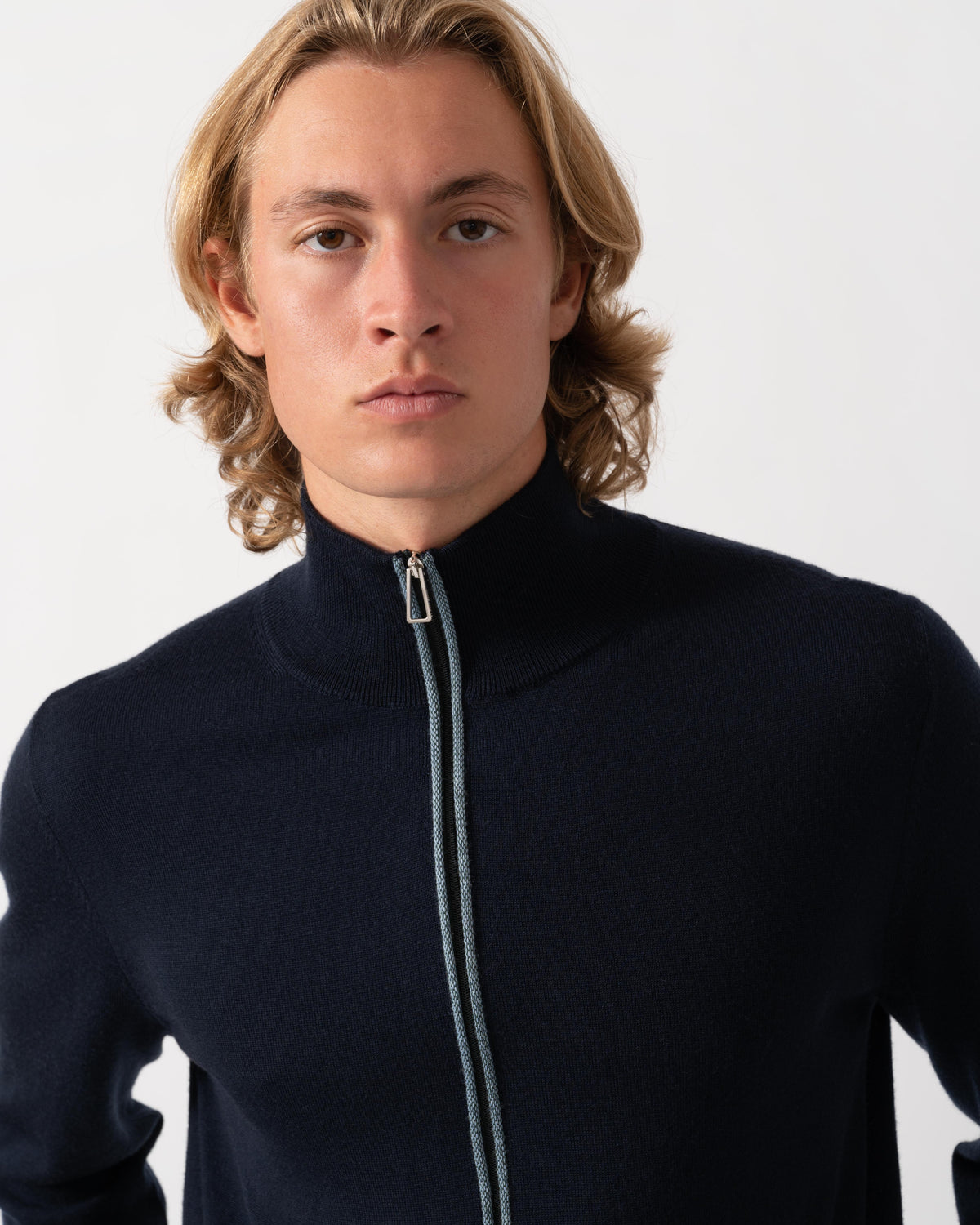 Close up of the Paul Smith's Mens Full Zip Funnel Neck Sweater in 49 Very Dark Navy