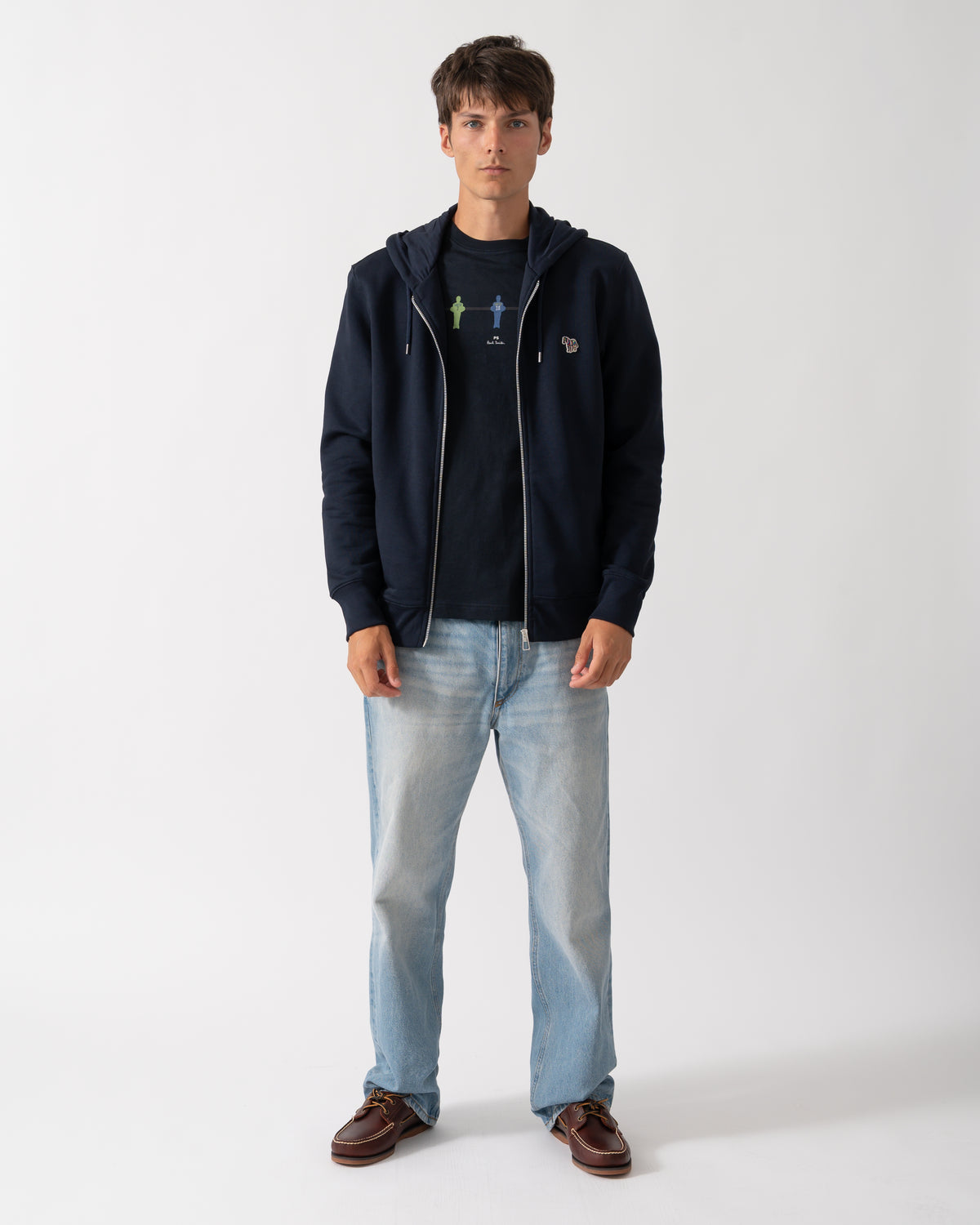 full length of a model wearing a PS Paul Smith Mens Full Zip Hoodie with Zebra Logo in 49 Very Dark Navy