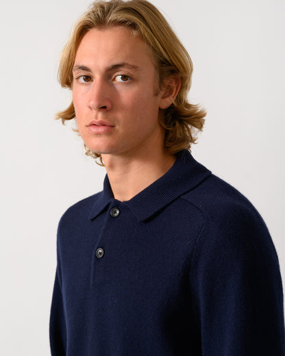 close up studio photo of a model wearing a PS Paul Smith Mens Long Sleeve Plain Polo Sweater in 49 Very Dark Navy