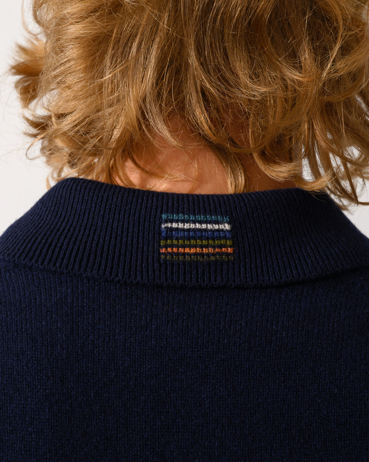 neck detail of a PS Paul Smith Mens Long Sleeve Plain Polo Sweater in 49 Very Dark Navy