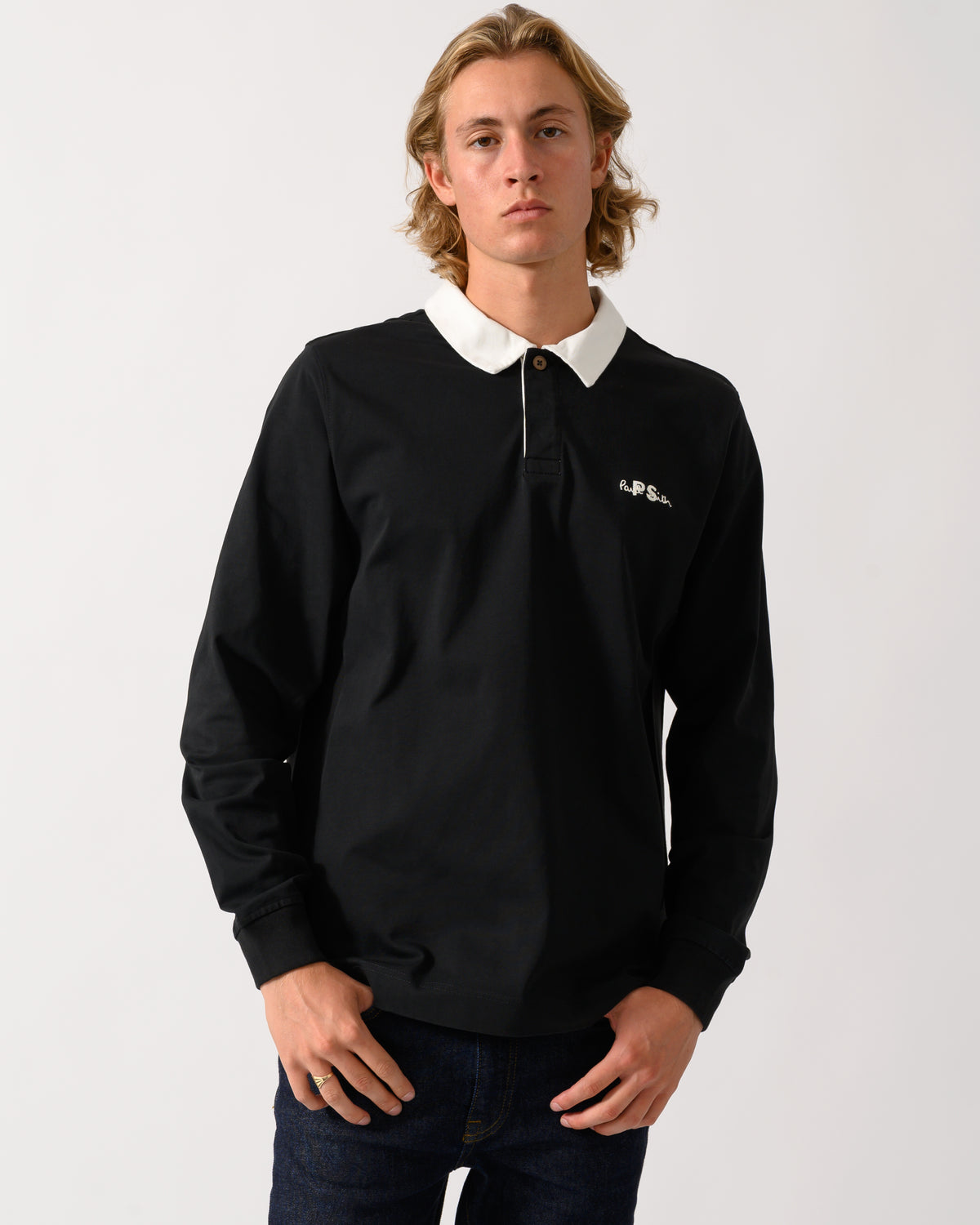 studio photograph of a model wearing a PS Paul Smith Mens Long Sleeve Signature Logo Polo a 79 Black