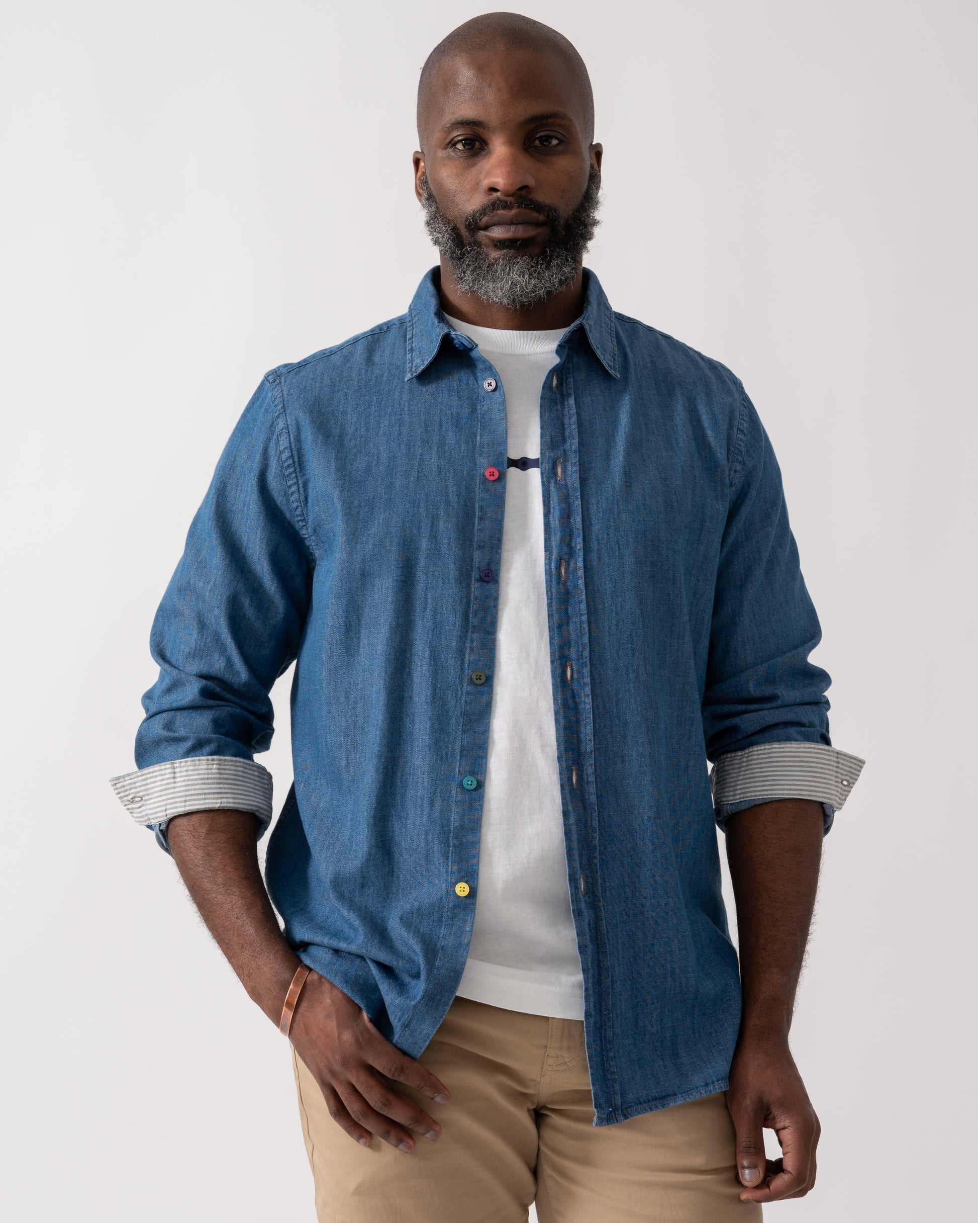 Model wearing a PS Paul Smith Mens Long Sleeve Tailored Fit Denim Shirt SS Buttons in MD Blue