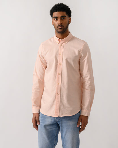 model wearing a PS Paul Smith Mens Long Sleeve Tailored Fit Shirt With Button Down Collar in Orange