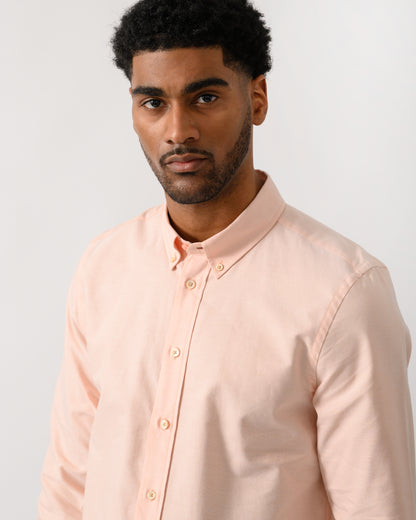 close up shot of a model wearing a PS Paul Smith Mens Long Sleeve Tailored Fit Shirt With Button Down Collar in Orange