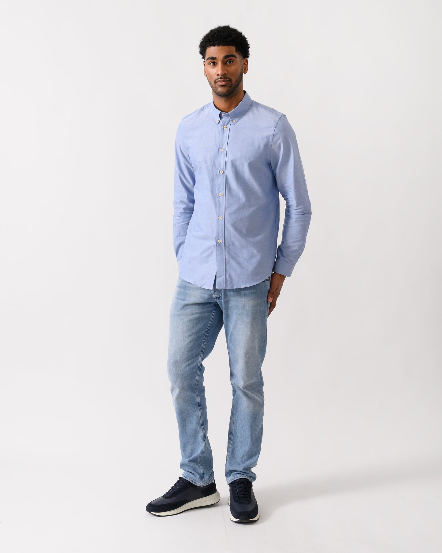 full length shot of a model wearing a PS Paul Smith Mens Long Sleeve Tailored Fit Shirt With Button Down Collar in 44 Blue