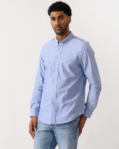 model wearing a PS Paul Smith Mens Long Sleeve Tailored Fit Shirt With Button Down Collar in 44 Blue