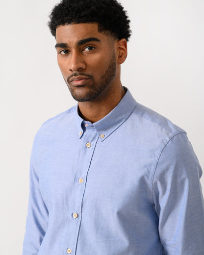 close up shot of a model wearing a PS Paul Smith Mens Long Sleeve Tailored Fit Shirt With Button Down Collar in 44 Blue