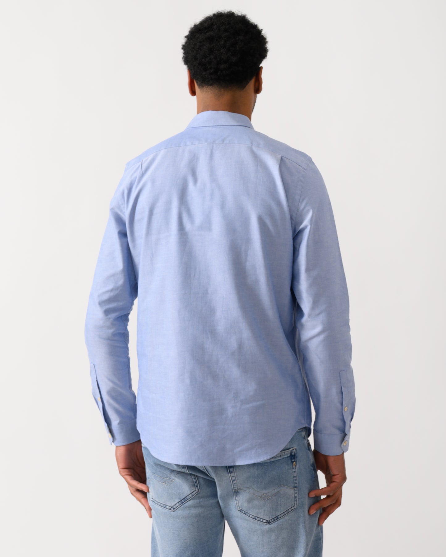 back shot of a model wearing a PS Paul Smith Mens Long Sleeve Tailored Fit Shirt With Button Down Collar in 44 Blue