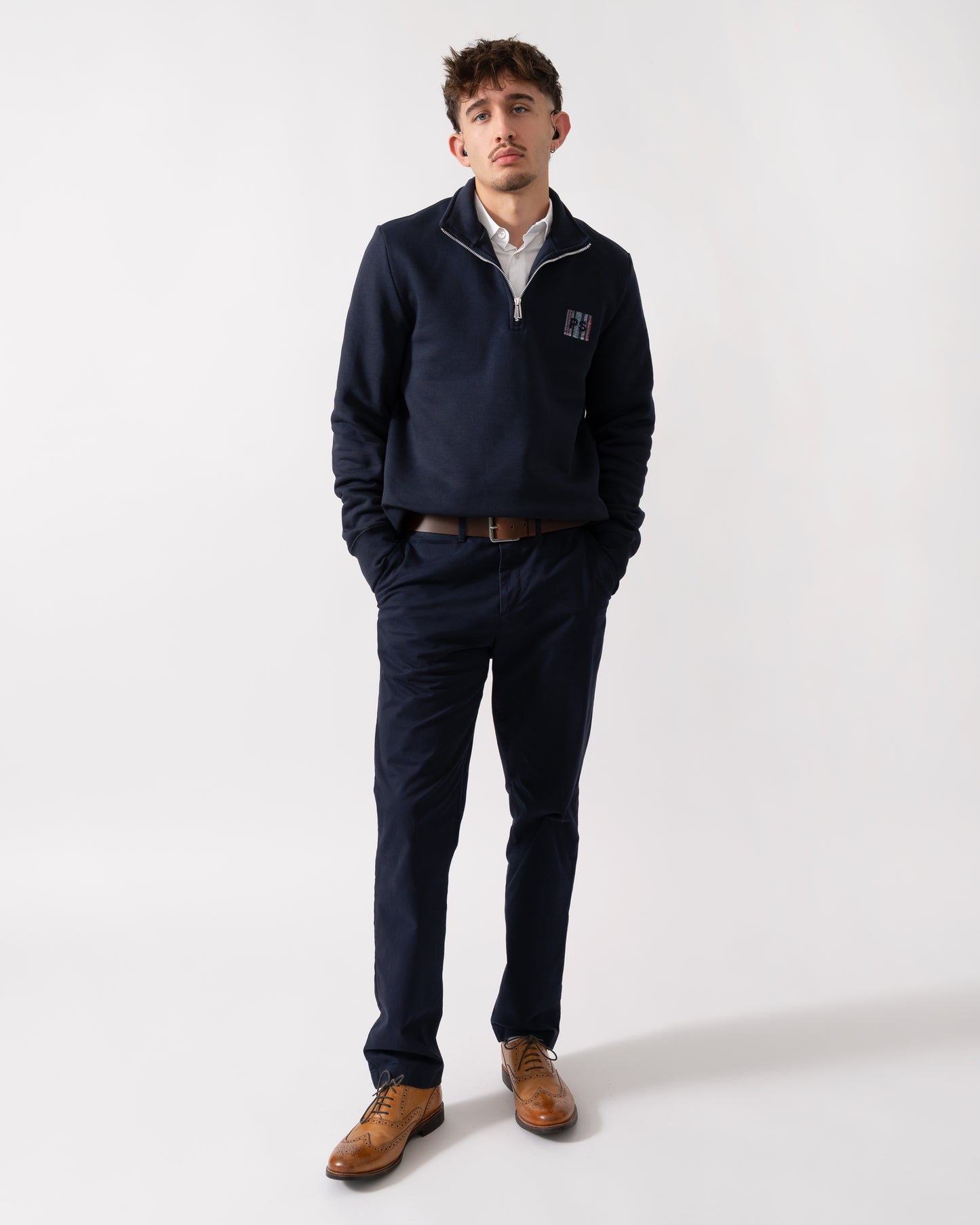Full length of a Model wearing a PS Paul Smith Mens Reg Fit Half Zip PS Logo Sweatshirt in Very Dark Navy