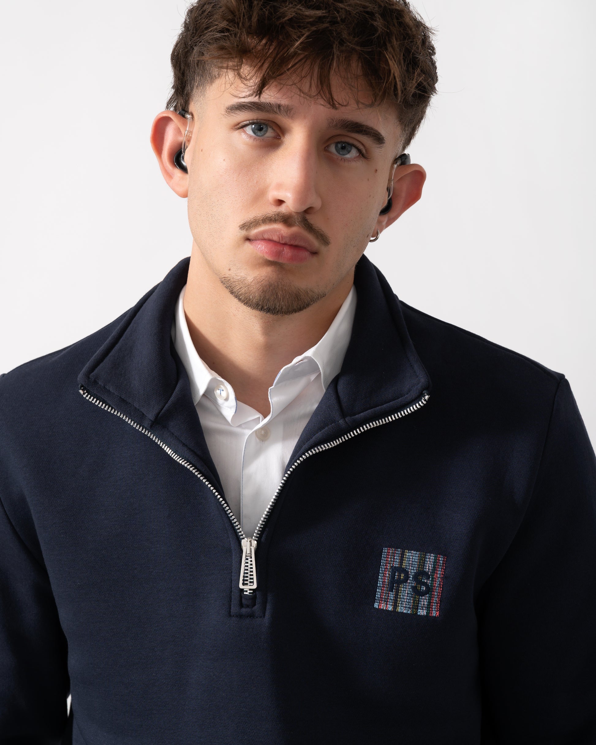 close up of a Model wearing a PS Paul Smith Mens Reg Fit Half Zip PS Logo Sweatshirt in Very Dark Navy
