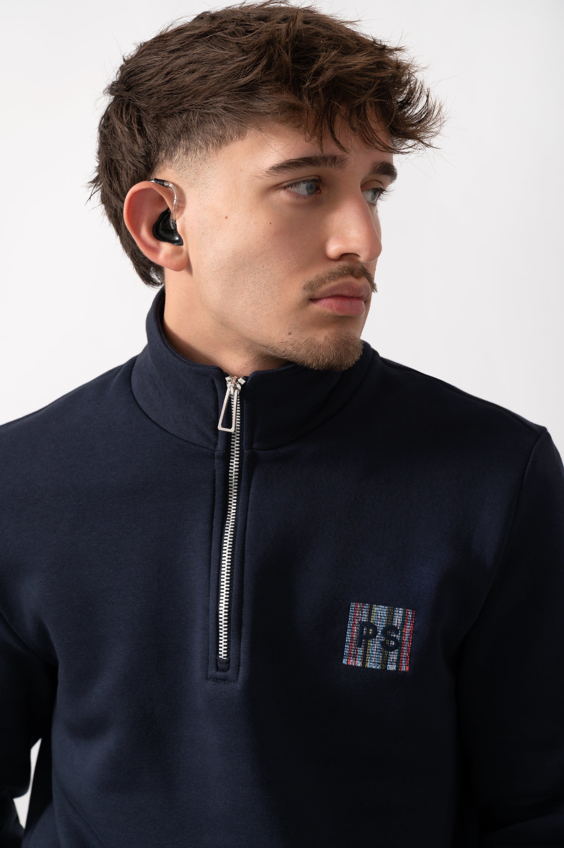 neck detail of a Model wearing a PS Paul Smith Mens Reg Fit Half Zip PS Logo Sweatshirt in Very Dark Navy