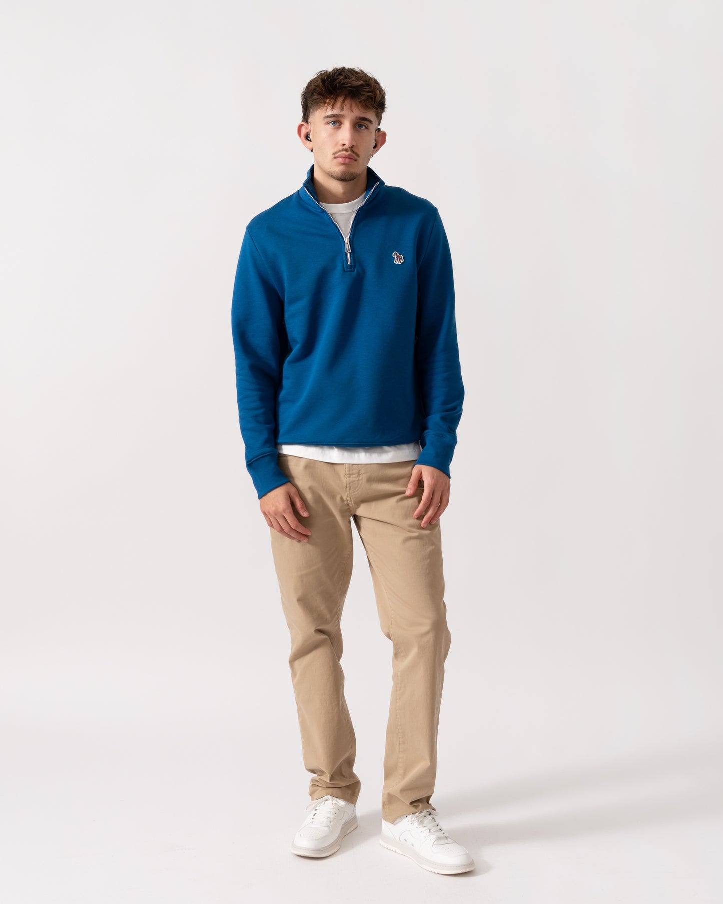 Full length shot of a Model wearing a PS Paul Smith Mens Reg Fit Half Zip Zebra Logo Top in Blue