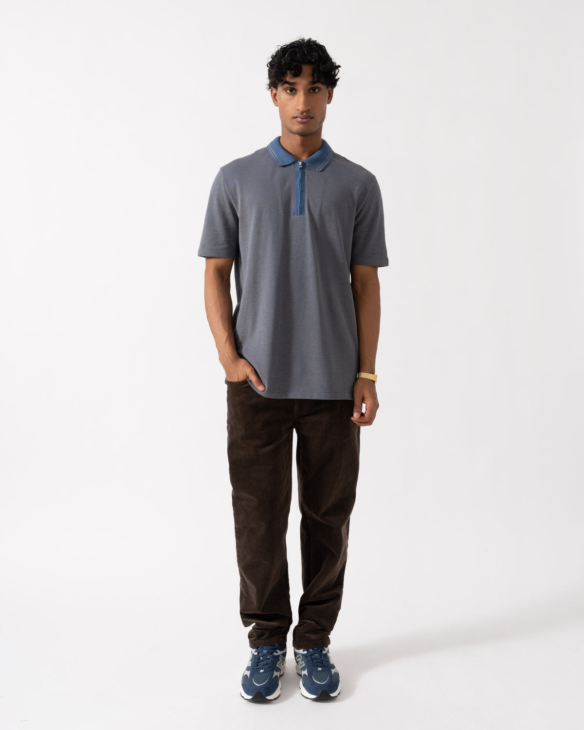 Man wearing the PS Paul Smith Mens Reg Fit Zip Polo Shirt - 46 Indigo