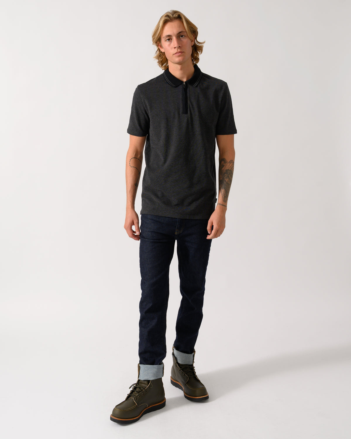 full length studio photograph of a model wearing a PS Paul Smith Mens Reg Fit Zip Polo Shirt in 79 Black