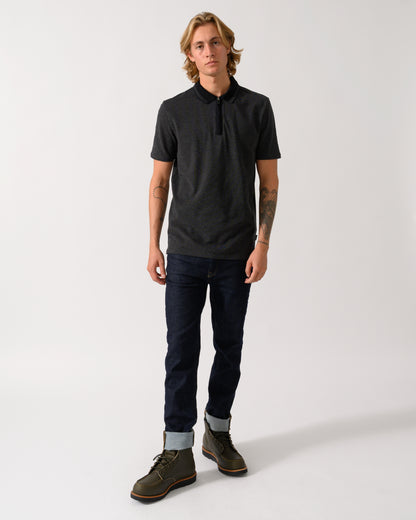 full length studio photograph of a model wearing a PS Paul Smith Mens Reg Fit Zip Polo Shirt in 79 Black