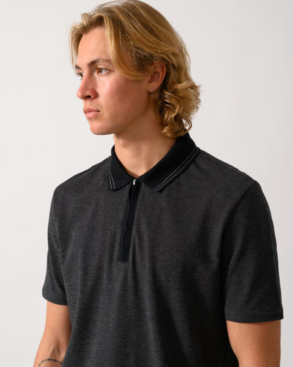 close up studio photograph of a model wearing a PS Paul Smith Mens Reg Fit Zip Polo Shirt in 79 Black