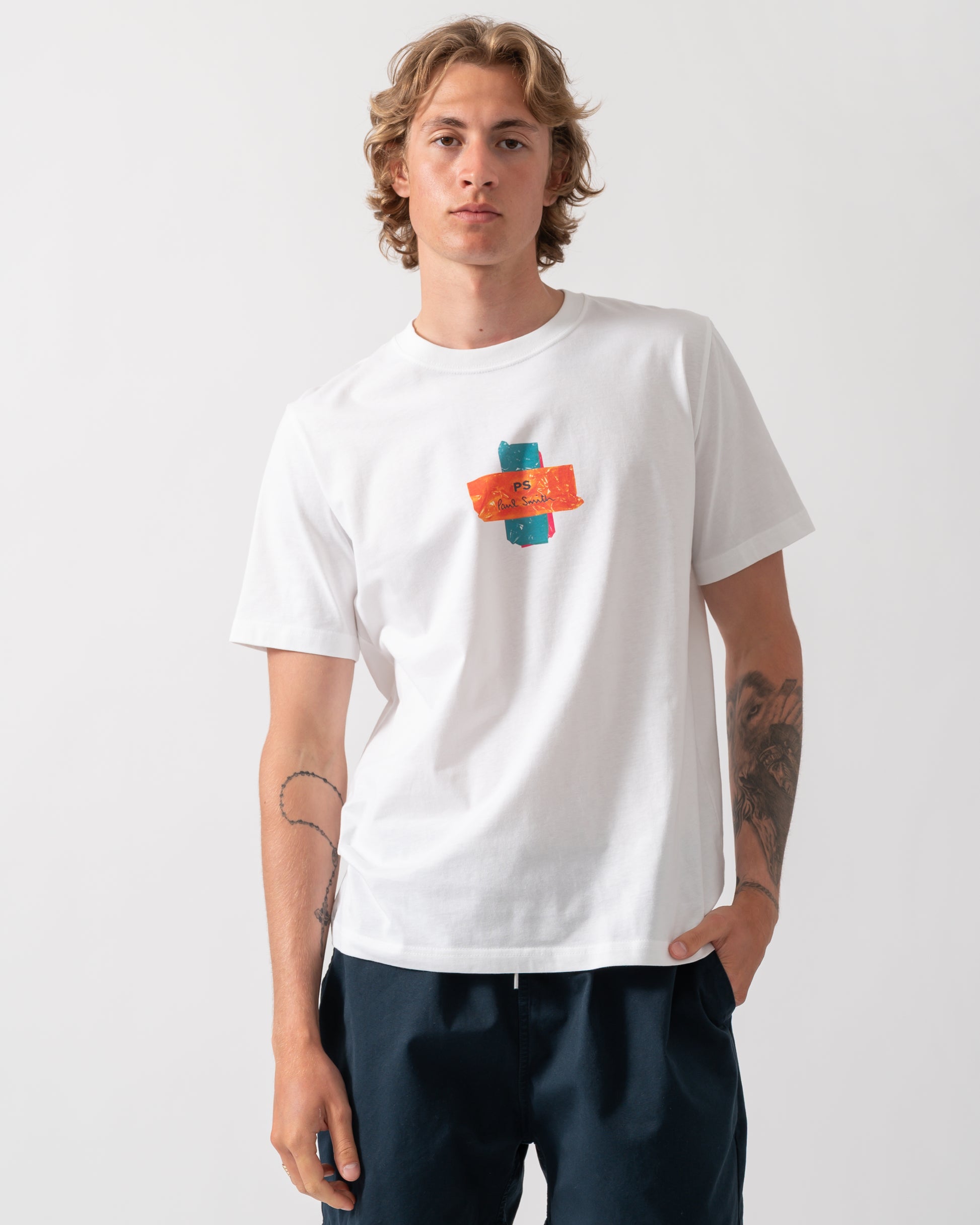 model wearing a PS Paul Smith Mens Regular Fit Cross T-Shirt in 01 White