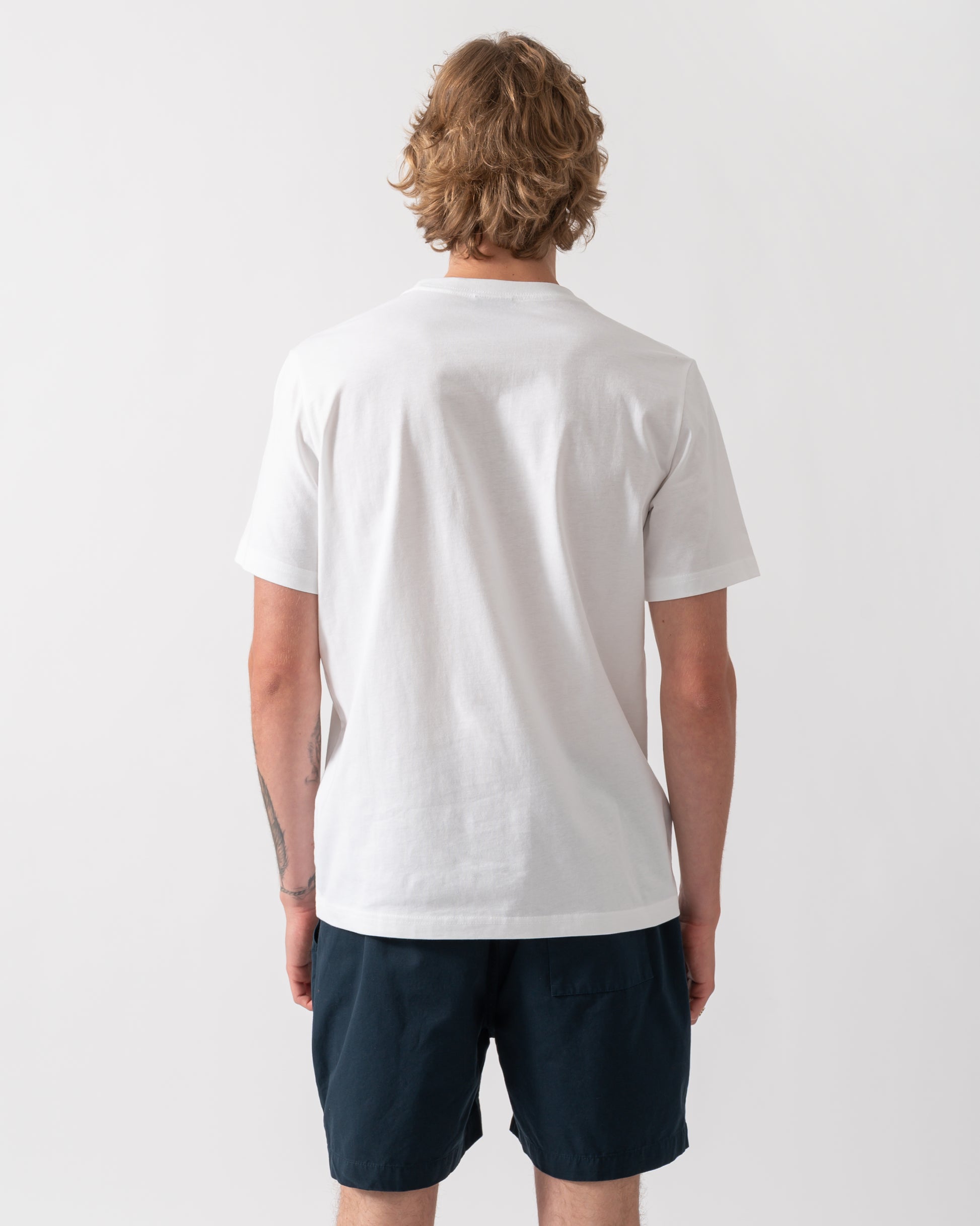 back of model wearing a PS Paul Smith Mens Regular Fit Cross T-Shirt in 01 White