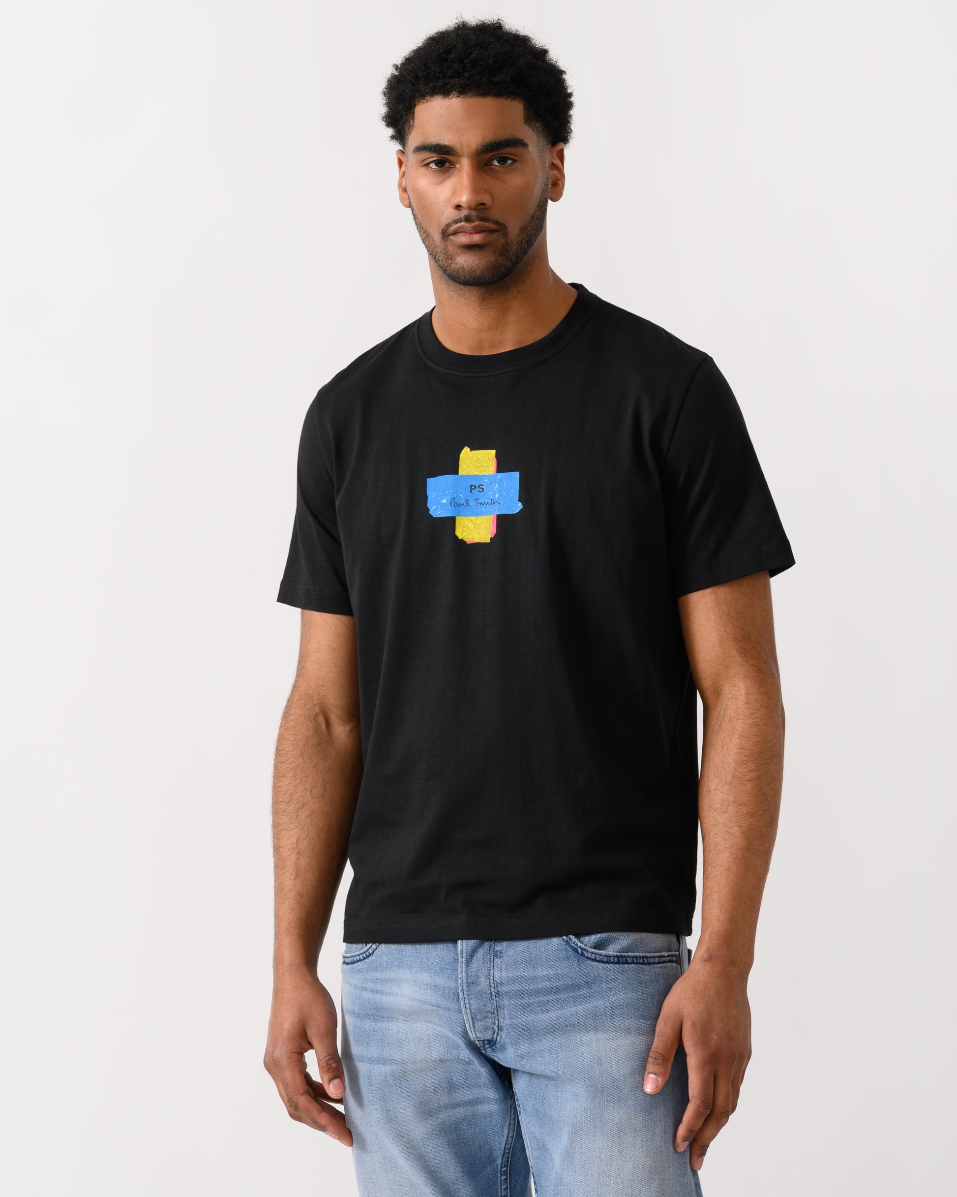 model wearing a PS Paul Smith Mens Regular Fit Cross T-Shirt in 79 Black