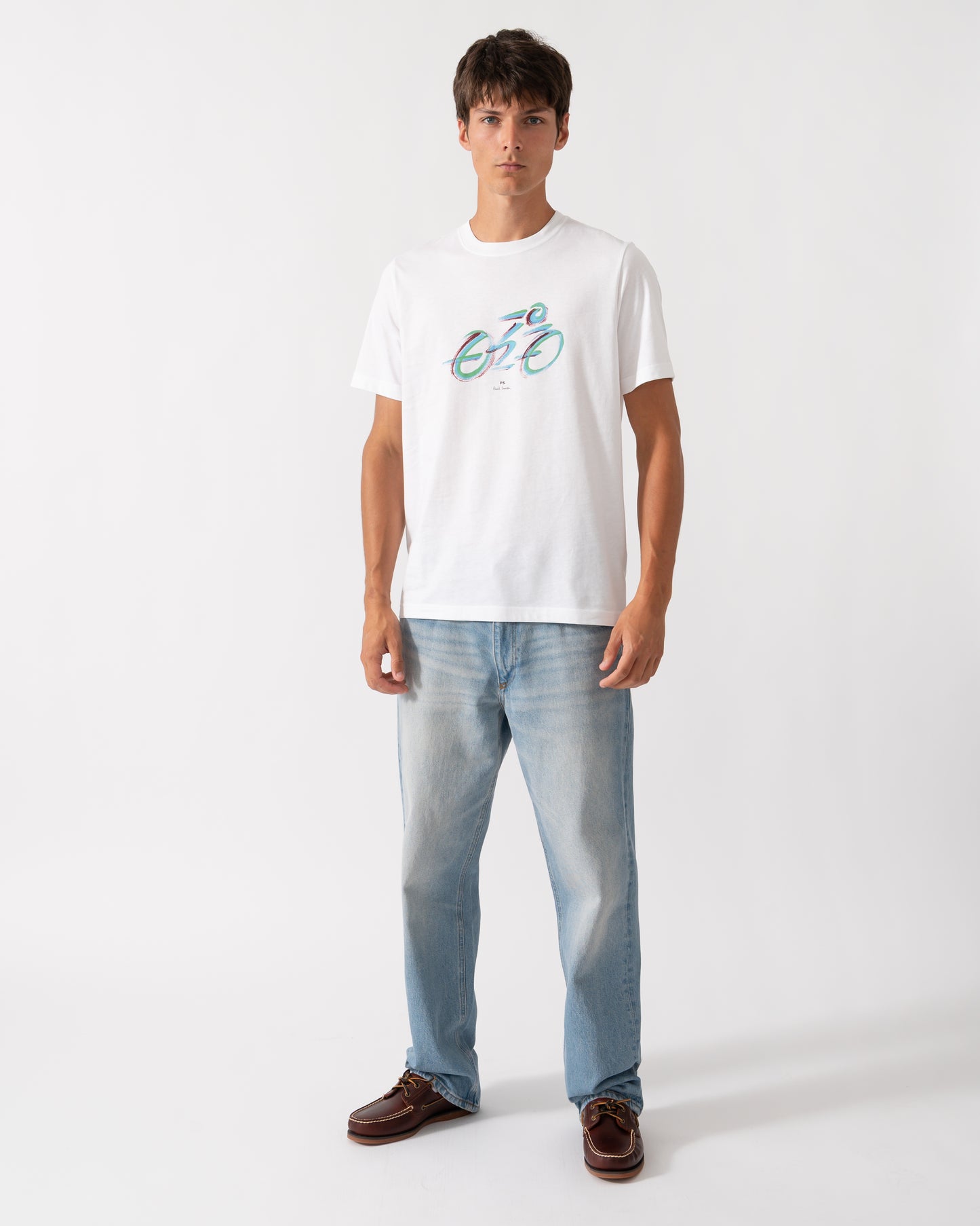 full length of a model wearing a PS Paul Smith Mens Regular Fit Cyclist Graphic T-Shirt in 01 White