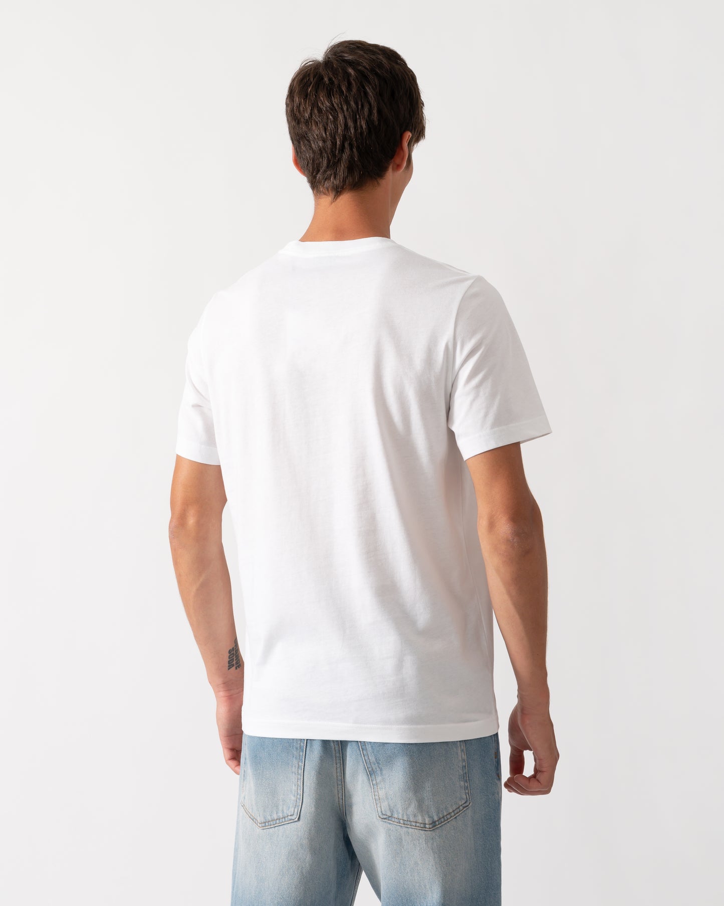 back of a model wearing a PS Paul Smith Mens Regular Fit Cyclist Graphic T-Shirt in 01 White