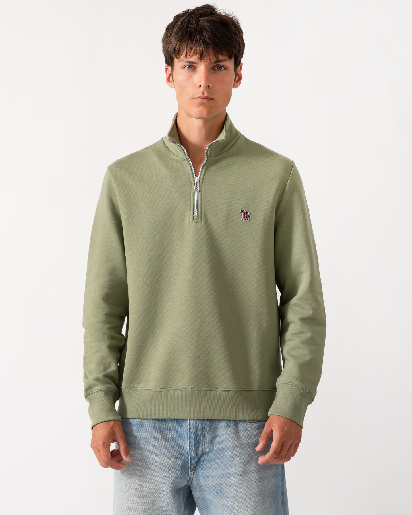 a model wearing a PS Paul Smith Mens Regular Fit Half Zip Sweatshirt with Zebra Logo in 34C Light Greyish Green
