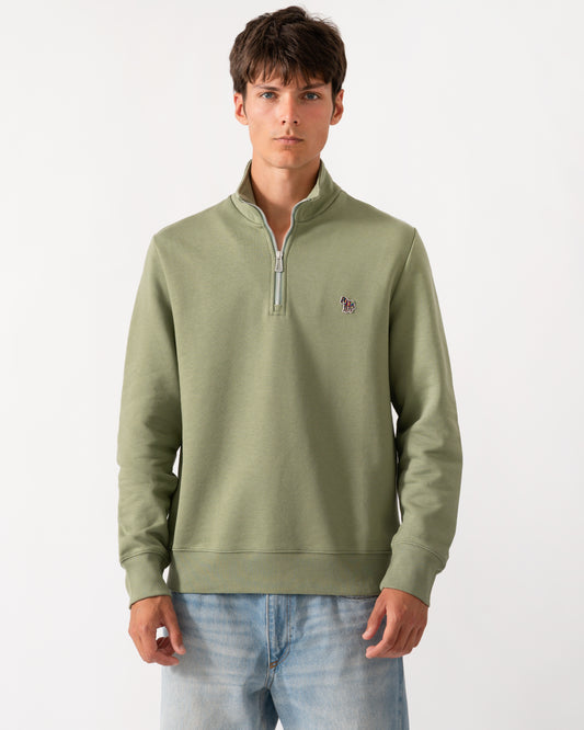 a model wearing a PS Paul Smith Mens Regular Fit Half Zip Sweatshirt with Zebra Logo in 34C Light Greyish Green
