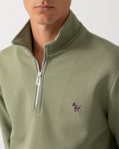 close up of a model wearing a PS Paul Smith Mens Regular Fit Half Zip Sweatshirt with Zebra Logo in 34C Light Greyish Green
