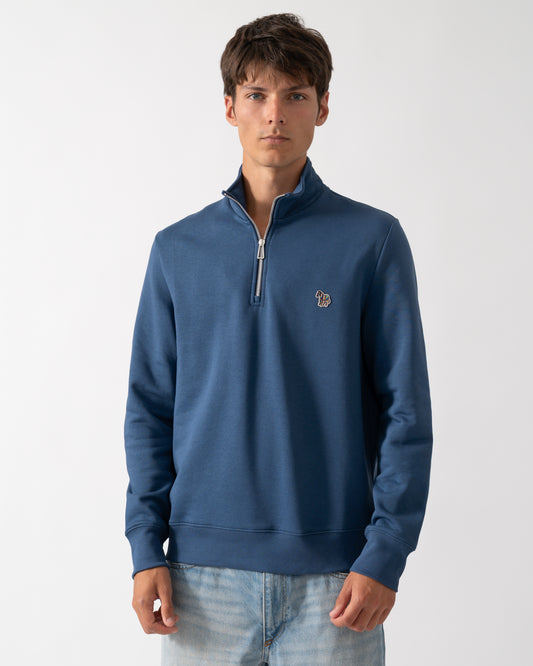 a model wearing a PS Paul Smith Mens Regular Fit Half Zip Sweatshirt with Zebra Logo in 46D Indigo