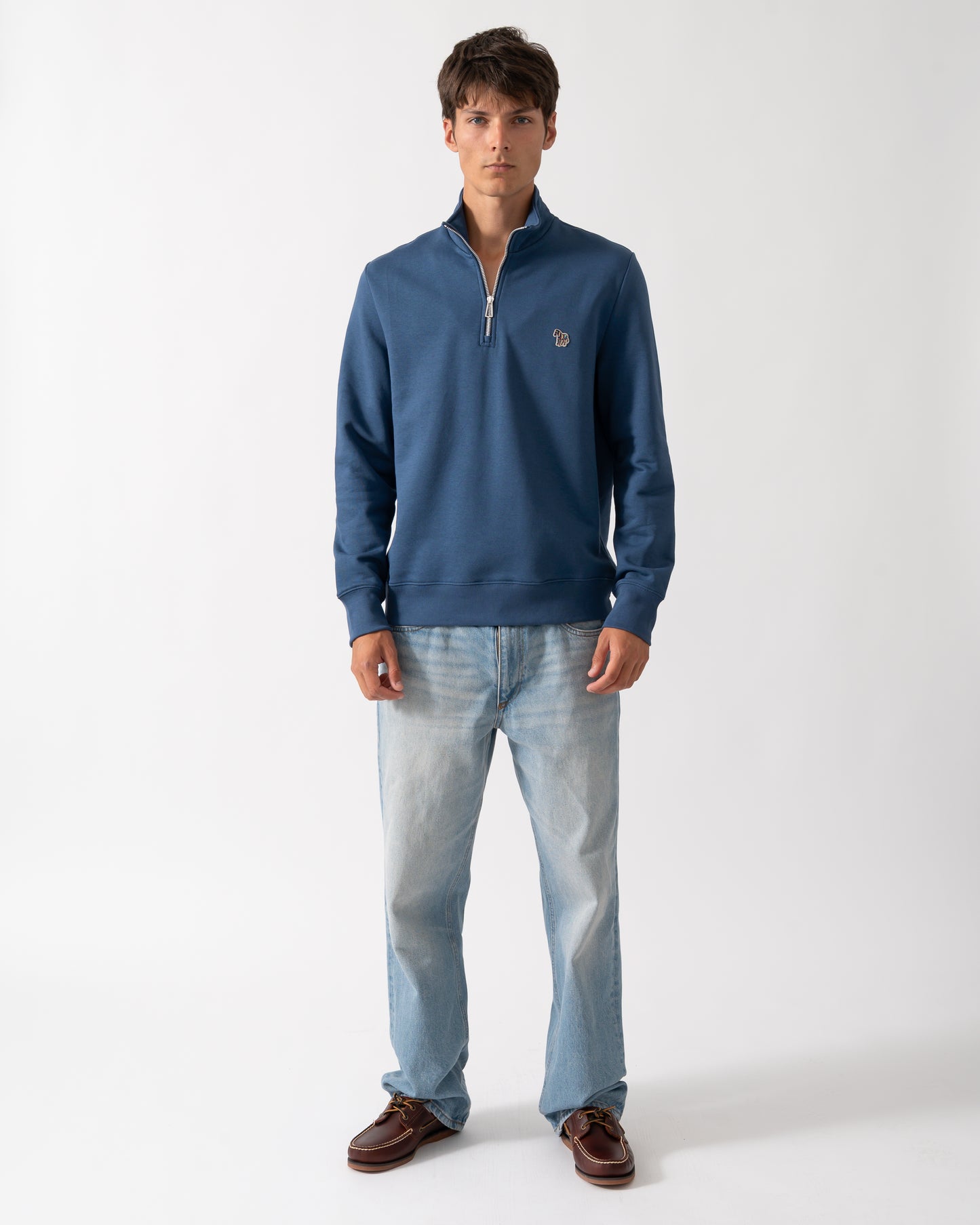full length of a model wearing a PS Paul Smith Mens Regular Fit Half Zip Sweatshirt with Zebra Logo in 46D Indigo