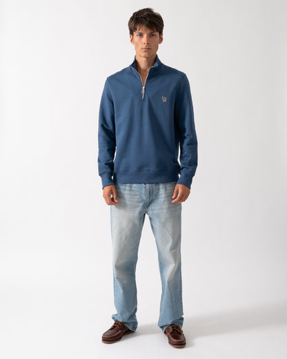 full length of a model wearing a PS Paul Smith Mens Regular Fit Half Zip Sweatshirt with Zebra Logo in 46D Indigo