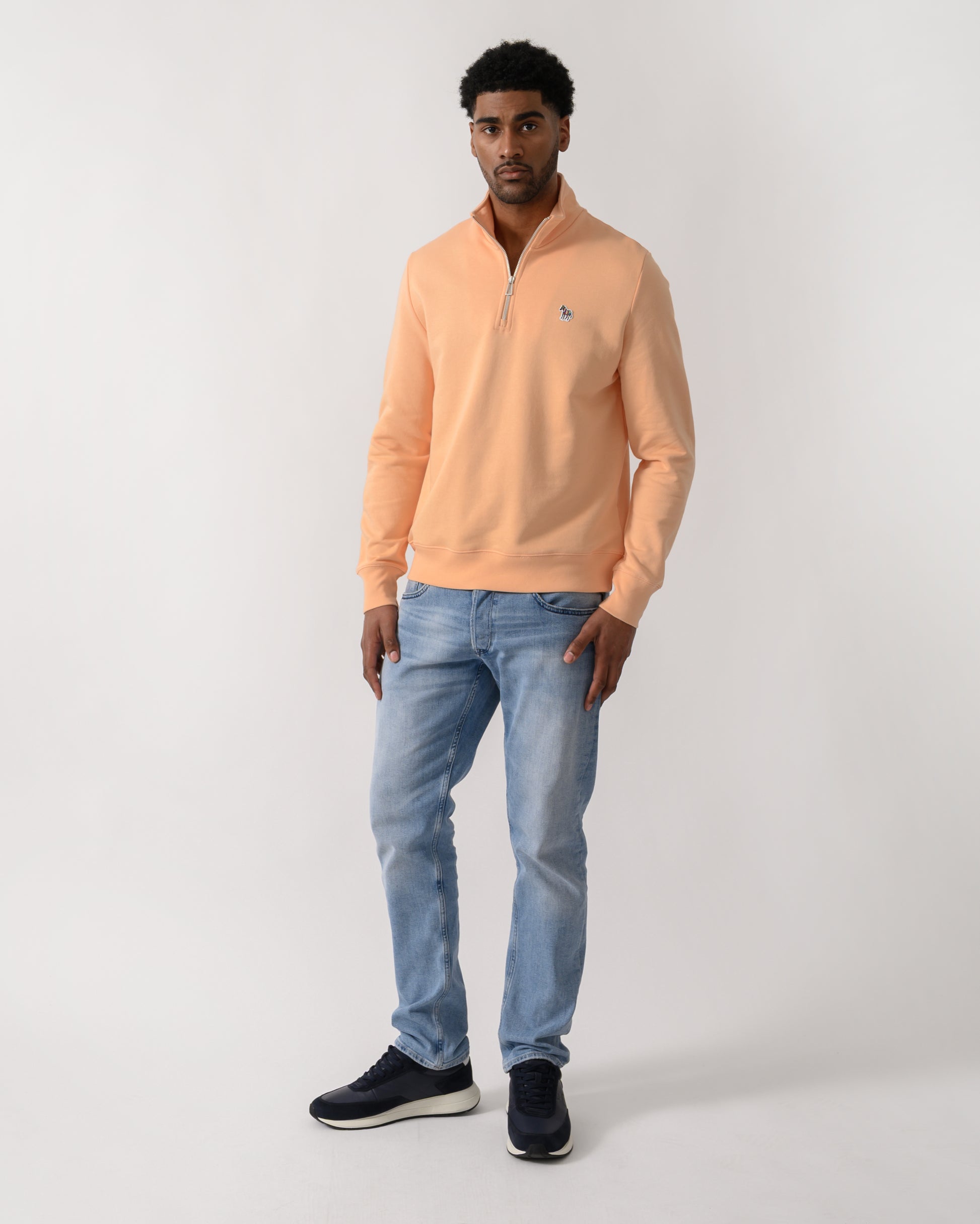 full length shot of a  model wearing a PS Paul Smith Mens Regular Fit Half Zip Zebra Logo Top in 15D Orange
