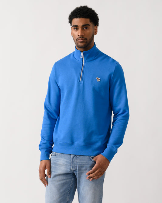 model wearing a PS Paul Smith Mens Regular Fit Half Zip Zebra Logo Top in 45E Blue