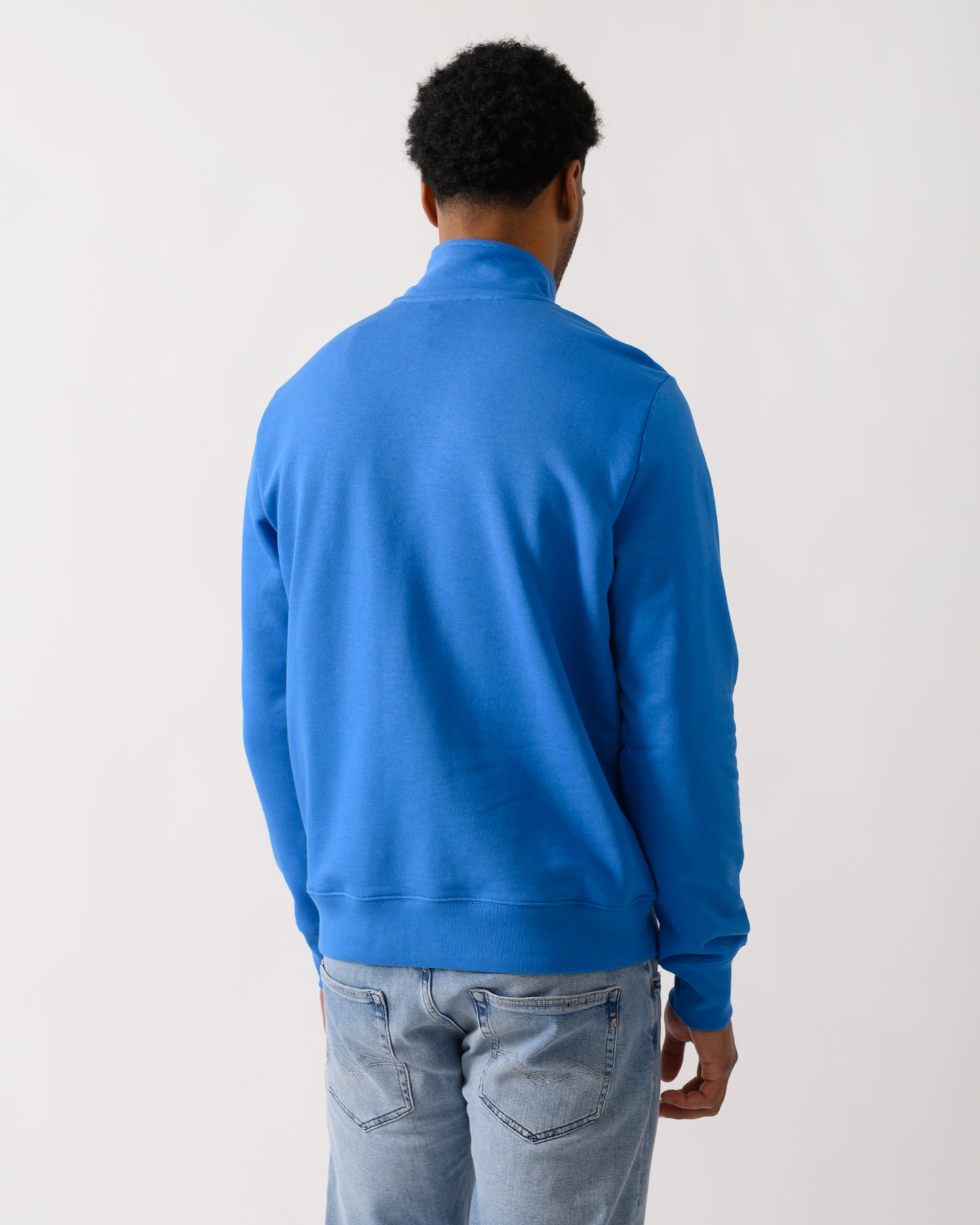 back shot of a model wearing a PS Paul Smith Mens Regular Fit Half Zip Zebra Logo Top in 45E Blue